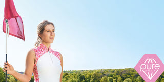 Lady golfer showcasing Pure Golf's New Spring Collection featuring the Petal Polka polo shirt.