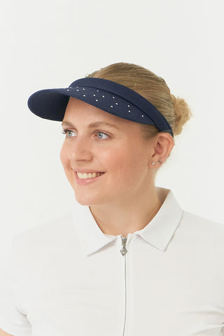 Navy Clip ladies golf visor,  100% polyester with quick-drying fabrics. The visor comes in a one size fits all design which clips around your head to hold it securely in place. It features a concealed magnet in in the strong curved, crystal detailed peak with a hand enameled flower look golf ball marker attached.  The headband features a soft lined absorbent towel.