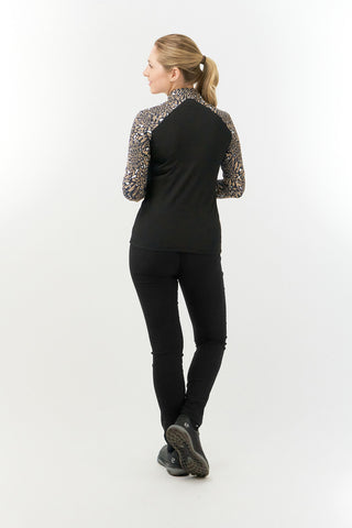 Pure Golf Maple is a long-sleeved golf top for ladies made from a super soft winterweight fabric that is brushed on the inside. With printed sleeves and shoulders patterned in brown, black and white for an extra flattering silhouette. The top has a quarter zip with a diamond logo zipper puller. Made from UPF35, 4-way stretch, anti-crease fabric for ultimate comfort