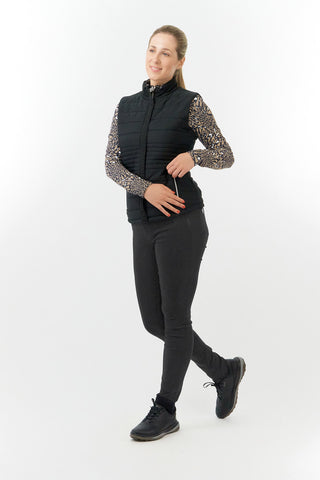 The Pure Golf Eve reversible ladies gilet for golf is insulated, winter-weight, patterned and reversible. It has been Insulated for warmth without being bulky. It has a unique animal print in wild truffle,  on one side and black on the other for versatility of wear. It has pockets on both sides and two-way zippers. The flattering quilting style and fit enhances your silhouette. The colors in this  this piece are Cappuccino,  Champagne and black.  