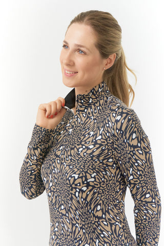 Pure Golf Arusha is a long-sleeved ladies winter weight golf top made from a super soft brushed fabric. It is two tone with a unique animal print in a soft cappuccino color with a high neckline.   A quick dry, made from UPF35, 4-way stretch, anti-crease fabric for ultimate comfort and fit. 