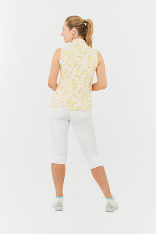 The Pure Golf back model shot of the Rise Sleeveless ladies' polo shirt boasting a striking Sun Kissed print with warm honey tones. Designed with a regular fit, it offers a 4-way stretch for comfort and a flattering shape on all body types. The stylish Mandarin collar adds a fashionable touch. This polo is made from 95% Polyester and 5% Spandex, offering anti-crease, anti-static, and quick-dry properties, along with UPF 50+ sun protection. Finish the look with our White Trust Capri's. 