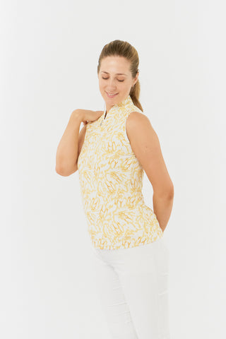 This Pure Golf side view shot features the Rise Sleeveless Ladies' Polo Shirt, showcasing a vibrant Sun Kissed print with warm honey hues. Designed with a regular fit, it provides 4-way stretch for comfort and a flattering shape on every body type. The trendy Mandarin collar adds a stylish detail. Made from 95% Polyester and 5% Spandex, the polo offers anti-crease, anti-static, and quick-dry benefits, along with UPF 50+ sun protection. 