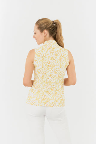 The Pure Golf Rise Sleeveless ladies' polo shirt shot from the back boasts a striking Sun Kissed print with warm honey tones. Designed with a regular fit, it offers a 4-way stretch for comfort and a flattering shape on all body types. The stylish Mandarin collar adds a fashionable touch. This polo is made from 95% Polyester and 5% Spandex, offering anti-crease, anti-static, and quick-dry properties, along with UPF 50+ sun protection. 