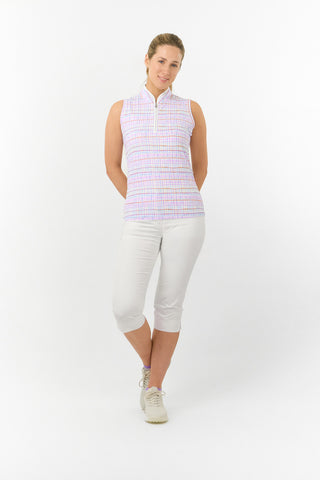 The model shot showcases the Pure Golf Rise Pastel Score Sleeveless Ladies' Golf Polo Shirt, featuring soft, refreshing pastel shades that evoke a springtime feel. With a regular fit and 4-way stretch, it offers comfort and a flattering silhouette for all body types. The mandarin collar adds a touch of elegance. Made from 95% polyester and 5% spandex, this polo provides anti-crease, anti-static, and quick-dry properties, along with UPF 50+ sun protection. It is paired with our White Trust Capri's. .