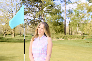 The close-up lifestyle shot features the Pure Golf Rise Pastel Score Sleeveless Ladies' Golf Polo Shirt, highlighting soft, refreshing pastel shades that evoke a springtime vibe. Designed with a regular fit and 4-way stretch, it provides comfort and a flattering silhouette for all body types. The mandarin collar adds a refined touch. Made from 95% polyester and 5% spandex, this polo offers anti-crease, anti-static, and quick-dry properties, along with UPF 50+ sun protection.