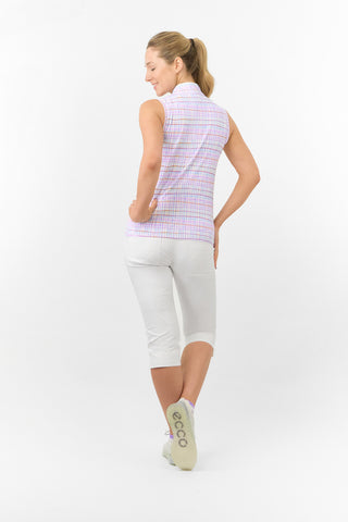 The model shot showcases the back of the Pure Golf Rise Pastel Score Sleeveless Ladies' Golf Polo Shirt, featuring soft, refreshing pastel shades that evoke a springtime feel. With a regular fit and 4-way stretch, it offers comfort and a flattering silhouette for all body types. The mandarin collar adds a touch of elegance. Made from 95% polyester and 5% spandex, this polo provides anti-crease, anti-static, and quick-dry properties, along with UPF 50+ sun protection. It is paired with White Bermuda Shorts.