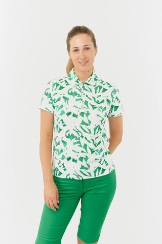 The Pure Golf Amity front shot of the short sleeve ladies golf polo shirt with botanical print in emerald green and white. It is a regular fit and has a 4 way stretch which ensures it is comfortable and flattering for all body types. It boasts a traditional collar for a classic and stylish look. The polo shirt is anti-crease, anti-static and quick dry with UPF 50+ which is 95% Polyester and 5% Spandex. 