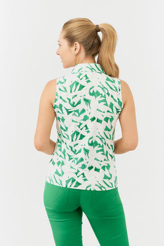 The back shot of the Pure Golf Amity model showcases the sleeveless ladies' golf polo shirt with a botanical print in emerald green and white. Designed with a regular fit, it features a 4-way stretch for comfort and a flattering shape on all body types. The polo is styled with a traditional collar for a classic, elegant look. Made from 95% Polyester and 5% Spandex, the fabric is anti-crease, anti-static, quick-drying, and offers UPF 50+ sun protection. It is paired with Emerald Green Bermuda Shorts.