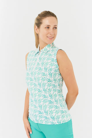 A side view model shot of the Pure Golf Amity Sleeveless Ladies' Golf Polo Shirt in Floating Palms White, showcasing a vibrant all-over botanical print in Ocean Colour on a clean white background. This regular-fit polo provides 4-way stretch for a flattering fit on all body types. Featuring a traditional collar, it exudes a timeless style. The shirt is designed to be anti-crease, anti-static, and quick-drying, while also offering UPF 50+ sun protection. Crafted from a blend of 95% Polyester and 5% Spandex.