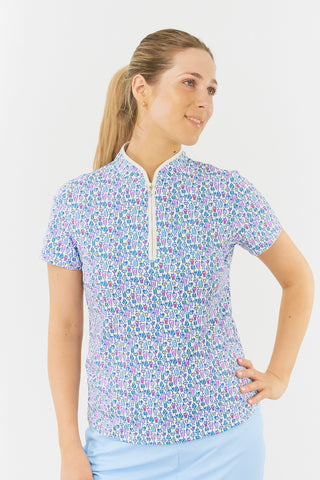 The Pure Golf Ellen short-sleeve ladies' polo shirt model shot front view showcasing our Over Eighteen Print featuring cocktail motifs in a subtle scale. Designed with a regular fit, it offers a 4-way stretch for comfort and a flattering shape on all body types. The stylish sweetheart collar adds a fashionable touch. This polo is made from 95% Polyester and 5% Spandex, offering anti-crease, anti-static, and quick-dry properties, along with UPF 50+ sun protection.