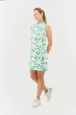 The Pure Golf model shot of the Wild Peony Emerald Miley Sleeveless dress features our botanical print.  Made in 4-way stretch material for maximum flexibility and unrestricted movement with detachable shorts for versatility and coverage. The mock neck collar offers a sleek, modern look and is a flattering fit on all body types. Designed to be anti-crease, anti-static, and quick drying. It provides UPF 50+, 95% Polyester and 5% Spandex.