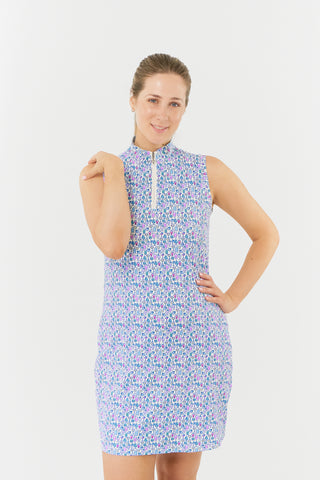 The Pure Golf model shot from the front of the Miley Sleeveless dress features our “Over Eighteen” print of cocktail motifs in a subtle scale and a mixture of blues, lilac and pinks. Made in 4-way stretch material for maximum flexibility and unrestricted movement with detachable shorts for versatility and coverage. The mock neck collar offers a modern look and is a flattering fit on all body types. Designed to be anti-crease, anti-static, and quick drying. It provides UPF 50+, 95% Polyester and 5% Spandex.