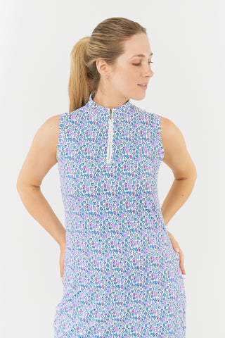 Pure Golf model shot of the Miley Sleeveless dress features our “Over Eighteen” print of cocktail motifs in a subtle scale and a mixture of blues and pinks. Made in 4-way stretch material for maximum flexibility and unrestricted movement with detachable shorts for coverage. The mock neck collar offers a sleek, modern look and is a flattering fit on all body types. Designed to be anti-crease, anti-static, and quick drying. It provides UPF 50+, 95% Polyester and 5% Spandex.