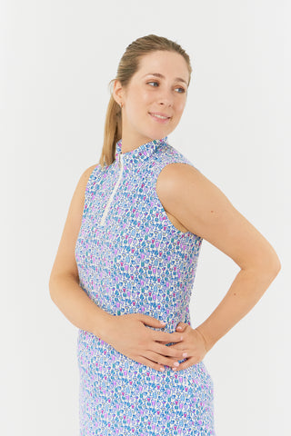 Pure Golf side model shot of the Miley Sleeveless dress features our “Over Eighteen” print of cocktail motifs in a subtle scale and a mixture of blues and pinks. Made in 4-way stretch material for maximum flexibility and unrestricted movement with detachable shorts for coverage. The mock neck collar offers a sleek, modern look and is a flattering fit on all body types. Designed to be anti-crease, anti-static, and quick drying. It provides UPF 50+, 95% Polyester and 5% Spandex.