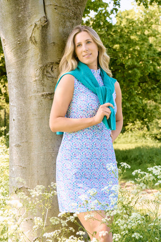 The Pure Golf lifestyle shot of the Miley Sleeveless dress features our “Over Eighteen” print of cocktail motifs in a subtle scale and a mixture of blues, lilac and pinks. Made in 4-way stretch material for maximum flexibility and unrestricted movement with detachable shorts for versatility and coverage. The mock neck collar offers a sleek, modern look and is a flattering fit on all body types. Designed to be anti-crease, anti-static, and quick drying. It provides UPF 50+, 95% Polyester and 5% Spandex.