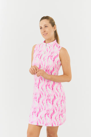 The Pure Golf model showcases the Rosewater Miley Sleeveless dress, featuring our delicate pink petals print. Made from 4-way stretch fabric for optimal flexibility and freedom of movement, it includes detachable shorts for added versatility and coverage. The mock neck collar creates a sleek, modern look and offers a flattering fit for all body types. Designed to be anti-crease, anti-static, and quick-drying, the dress provides UPF 50+ protection. It is composed of 95% Polyester and 5% Spandex.