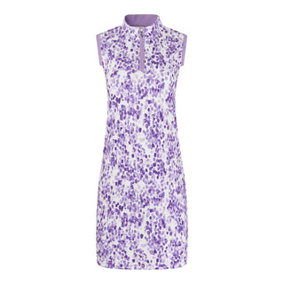 The Pure Golf product image of the Heather Sleeveless Dress highlights a chic two-tone blend of purple and lilac, complemented by a slimming lilac side panel. Crafted from 4-way stretch fabric, it offers flexibility, while removable shorts provide extra coverage. The mock neck collar adds a contemporary and flattering detail for all body types. Designed to be anti-crease, anti-static, and quick-drying, this dress also provides UPF 50+ protection. It is made from 95% polyester and 5% spandex.