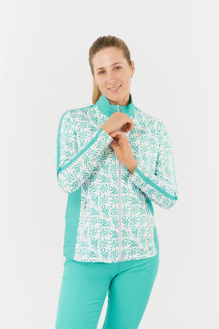 The front model shot of the Pure Golf Gella Ladies Golf Mid Layer Jacket in Floating Palms White showcases a bold botanical print on a crisp white background, with ocean block color accents on the mock neck, sides, and thin stripes down each arm. This regular-fit polo offers 4-way stretch for a flattering fit on all body types. Made from 95% Polyester and 5% Spandex, the jacket is designed with anti-crease, anti-static, and quick-drying features, along with UPF 50+ sun protection for added functionality.