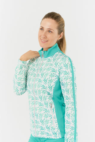 The close-up side model shot of the Pure Golf Gella Ladies Golf Mid Layer Jacket in Floating Palms White showcases a vibrant botanical print against a crisp white background, complemented by ocean block color accents on the mock neck, sides, and thin stripes along each arm. This regular-fit polo provides 4-way stretch for a flattering fit on all body types. Made from 95% Polyester and 5% Spandex, the jacket features anti-crease, anti-static, and quick-drying properties, along with UPF 50+.