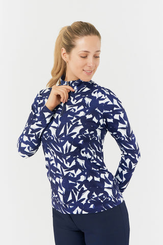 The Pure Golf Serenity long-sleeve ladies' golf zip top is shown here from the front, featuring our botanical print in Wild Peony Navy. Designed with a regular fit, it offers a 4-way stretch for both comfort and a flattering shape on all body types. The mock neck collar provides a sleek, modern appearance while offering additional coverage. Made from 95% Polyester and 5% Spandex, this fabric is anti-crease, anti-static, and quick-drying, with added UPF 50+ sun protection.