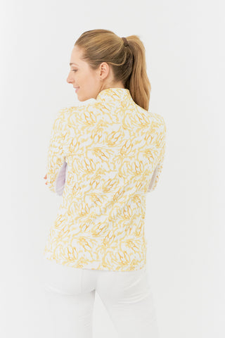 A back model shot of the Pure Golf Balance Sun Kissed Long Sleeve Ladies' Golf Zip Top from our Ray Flower collection shows a beautiful print in warm honey hues. With a regular fit and 4-way stretch, it ensures comfort for all body types. The mock neck collar adds a sleek touch, white mesh sleeve panels enhance breathability. Crafted from 95% polyester and 5% spandex, it offers anti-crease, anti-static, and quick-dry properties, along with UPF 50+ protection. Looks great Paired with White Trust Capri's.