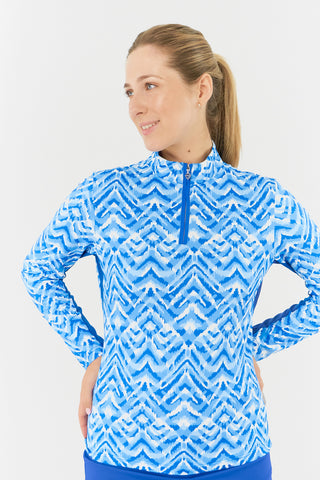 
The close-up front model shot of the Pure Golf Balance Santorini Skies Long Sleeve Ladies' Golf Zip Top showcases a mesmerizing Ikat-inspired design in shades of blue and white. With a regular fit and 4-way stretch, it ensures comfort for all body types. The sleek mock neck collar adds a stylish touch, while the mesh inside sleeve and underarm panels in Royal Blue enhance breathability. Made from 95% polyester and 5% spandex, it offers anti-crease, anti-static, and quick-dry properties, along with UPF 50+.