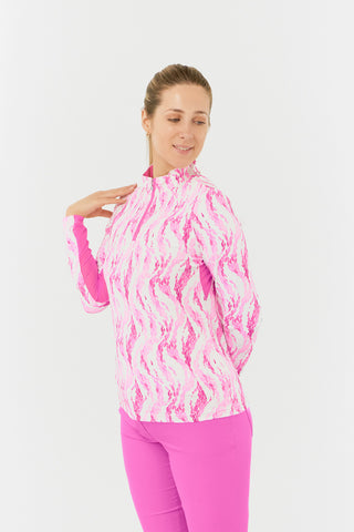 The Pure Golf Balance long-sleeve ladies' golf zip top in Rose Water, shown in a side model shot, features layers of delicate petals in shades of pink. Designed with a regular fit, it offers 4-way stretch for flexibility across all body types. The mock neck collar adds a modern touch, while the mesh sleeve panels improve breathability. Made from 95% Polyester and 5% Spandex, the top is anti-crease, anti-static, quick-drying, and provides UPF 50+ sun protection. It pairs with Azalea Bermuda Shorts. 