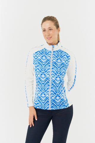 The Pure Golf Gia model shot features the mid layer jacket in Santorini Skies: A captivating Ikat-inspired blue print, beautifully placed inside the mock collar and across the main body, with a slim seam running from the shoulders down the sleeves. 4-way stretch for comfort and a flattering fit on all body types. Designed to be anti-crease, anti-static, and quick drying, it also provides UPF 50+ protection. Made from 95% Polyester and 5% Spandex.